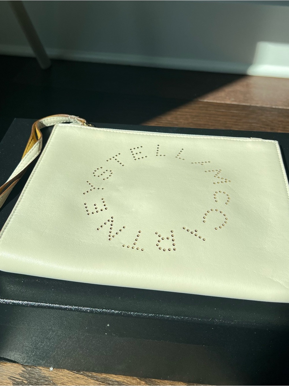 Stella McCartney Cream Perforated Logo Wristlet Clutch
